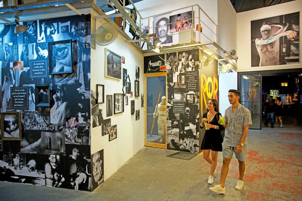 Fábrica de Arte Cubano, Havana – Photo: Alamy couple walking inside an art exhibition venue